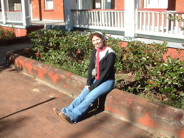 Monica loitering in front of her new apartment building.