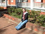 Monica loitering in front of her new apartment building.